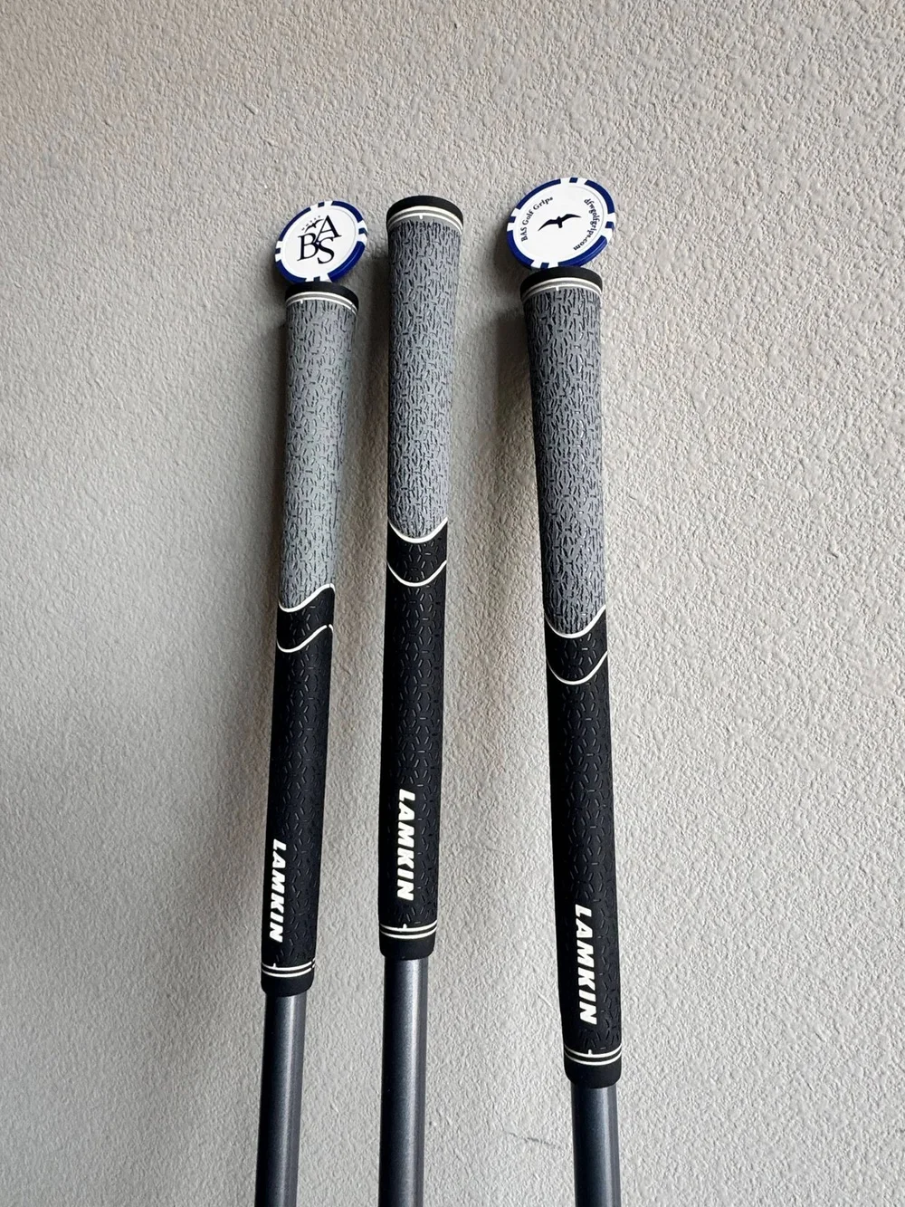Close view of finished black and gray golf grips installed by BAS Golf
